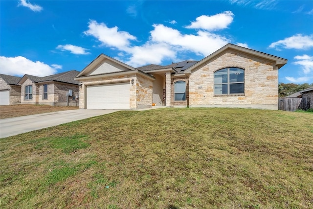 view of front of house with a garage and a front yard