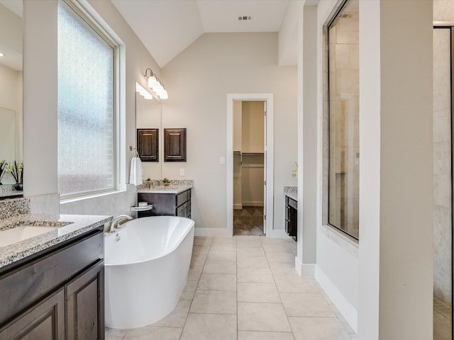 bathroom with vanity, tile patterned floors, plus walk in shower, and lofted ceiling