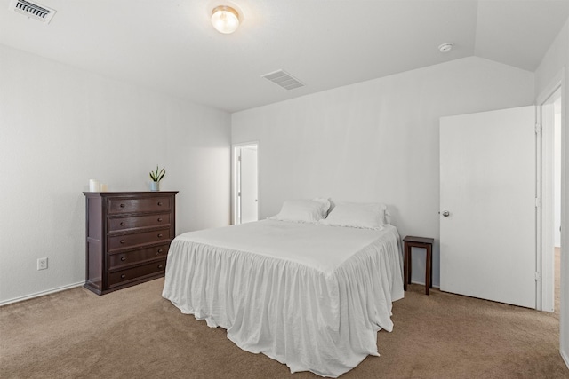 carpeted bedroom with vaulted ceiling