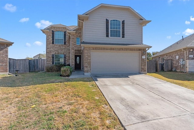 view of property featuring a front lawn and a garage