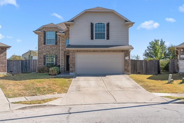 front of property with a garage and a front lawn