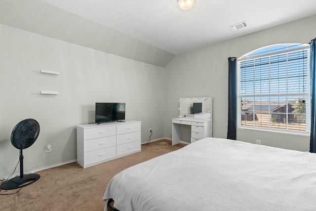 carpeted bedroom featuring lofted ceiling