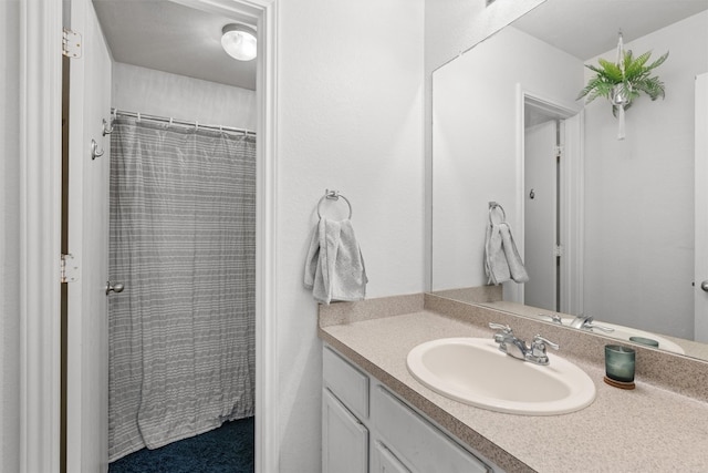 bathroom with vanity and walk in shower