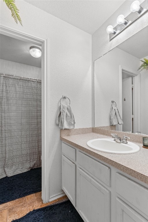 bathroom featuring vanity and tile patterned flooring