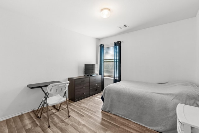 bedroom with light wood-type flooring