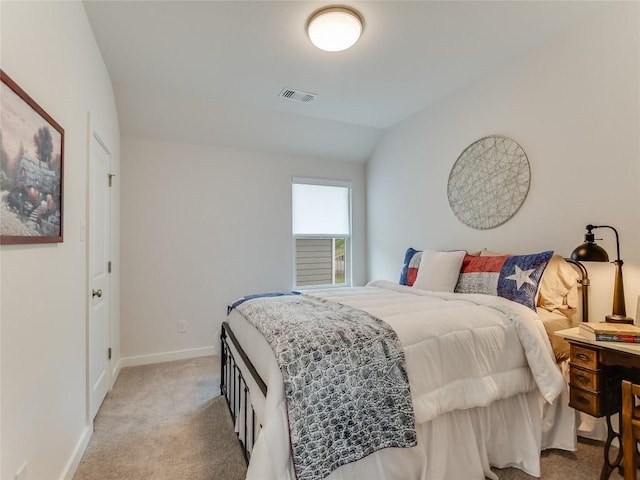 bedroom with light carpet and vaulted ceiling