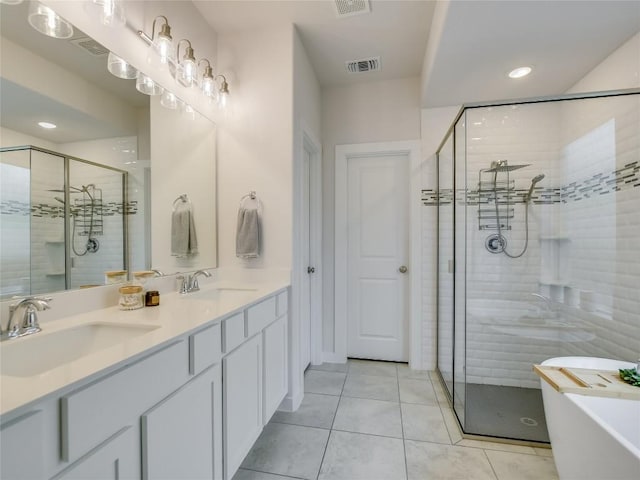 bathroom with separate shower and tub, tile patterned floors, and vanity