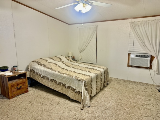 carpeted bedroom with crown molding, a textured ceiling, cooling unit, and ceiling fan