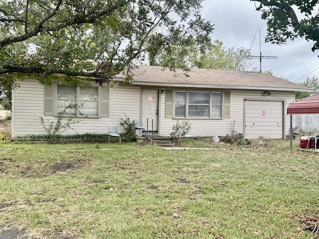 ranch-style home with a front yard and a garage