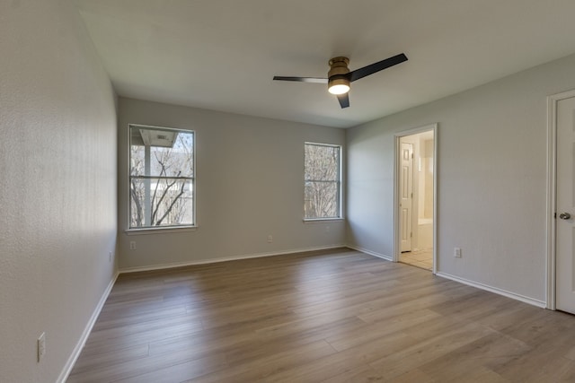 unfurnished bedroom with multiple windows and light hardwood / wood-style flooring