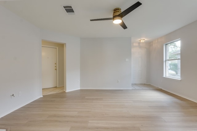 spare room with light hardwood / wood-style floors and ceiling fan