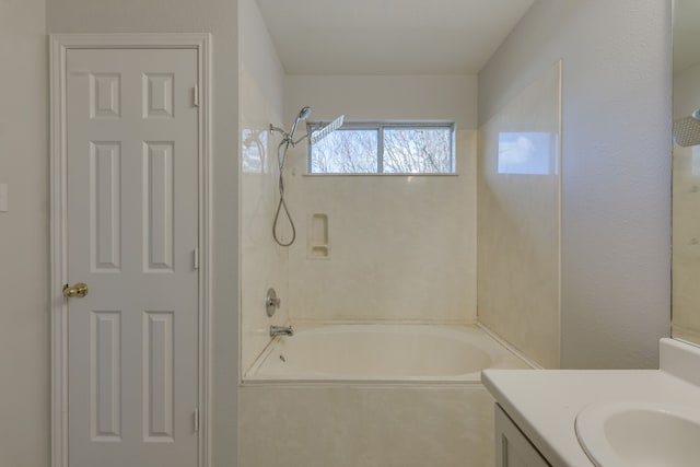 bathroom with vanity and tiled shower / bath combo