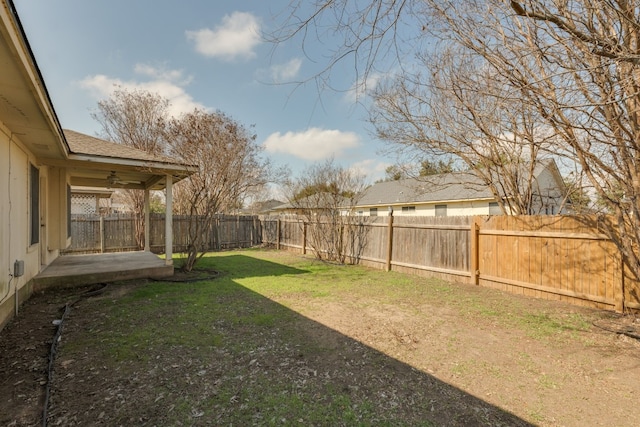 view of yard featuring ceiling fan