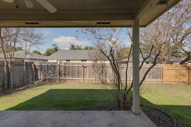 view of yard with ceiling fan