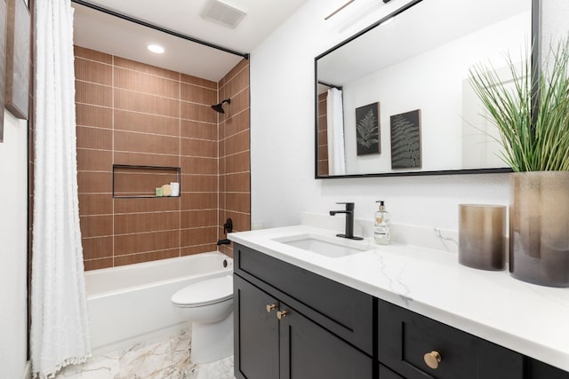 full bathroom with vanity, toilet, and shower / tub combo with curtain