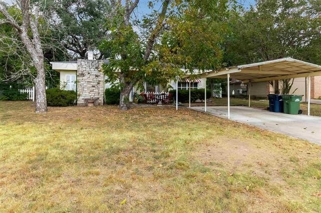 view of yard with a carport