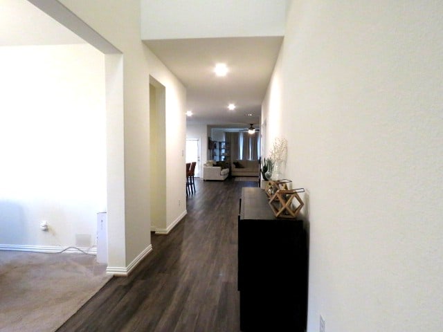 hallway featuring dark hardwood / wood-style flooring