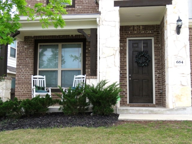 entrance to property with a porch