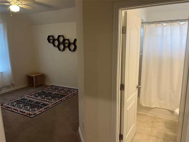 interior space with ceiling fan and light tile patterned floors