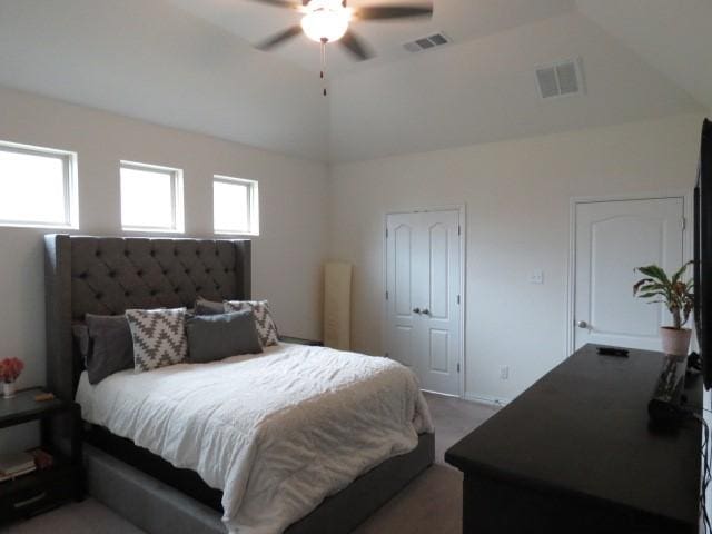 bedroom with ceiling fan and lofted ceiling