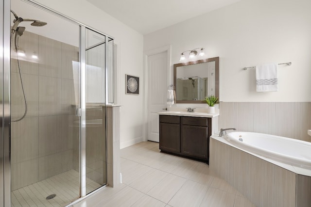 bathroom featuring vanity, shower with separate bathtub, and tile patterned floors