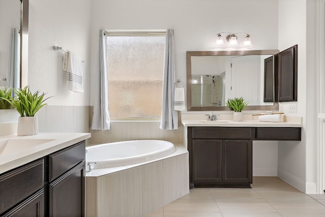 bathroom with vanity, plus walk in shower, and tile patterned floors