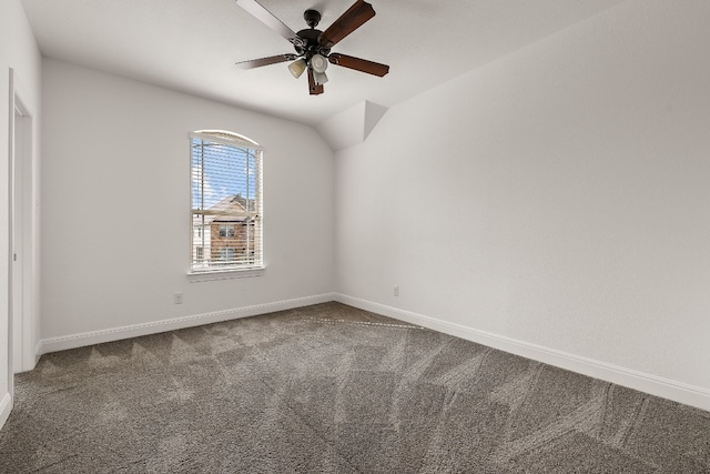 spare room featuring ceiling fan, carpet flooring, and lofted ceiling