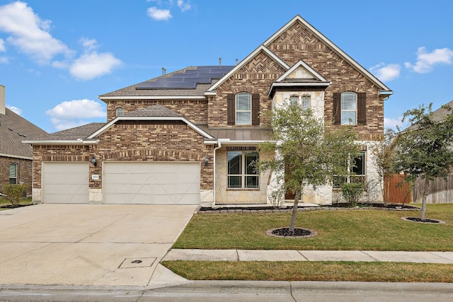 view of front of house with solar panels and a front lawn