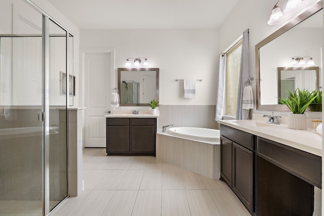 bathroom with vanity, separate shower and tub, and tile patterned floors