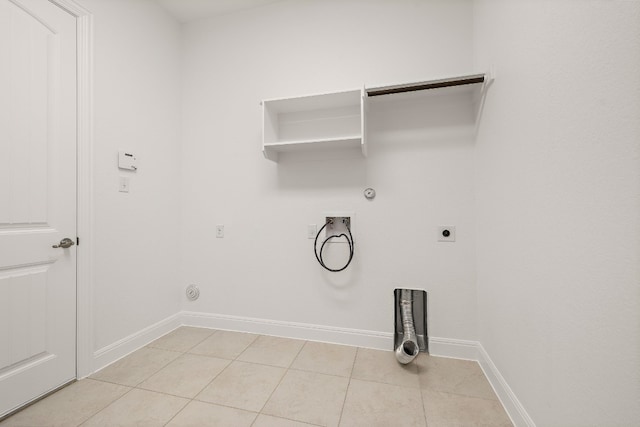 clothes washing area with hookup for an electric dryer, light tile patterned floors, washer hookup, and gas dryer hookup