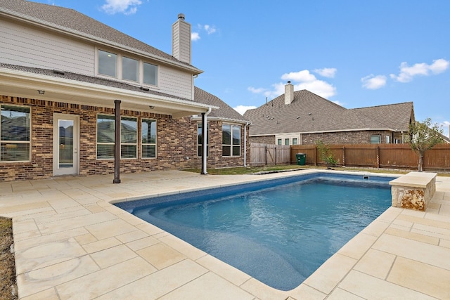 view of pool with a patio area