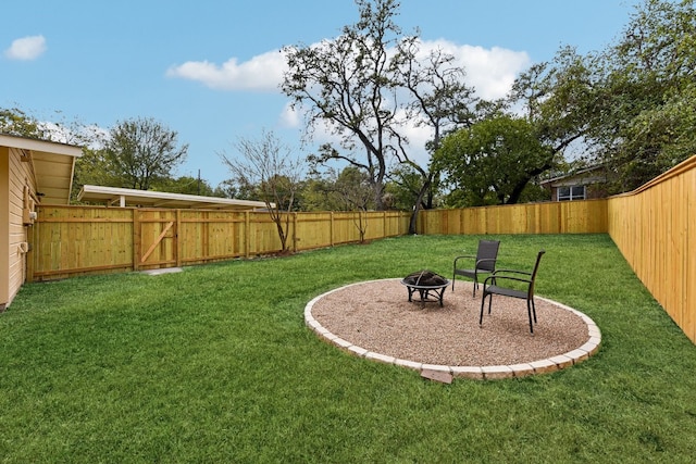 view of yard with a patio and an outdoor fire pit