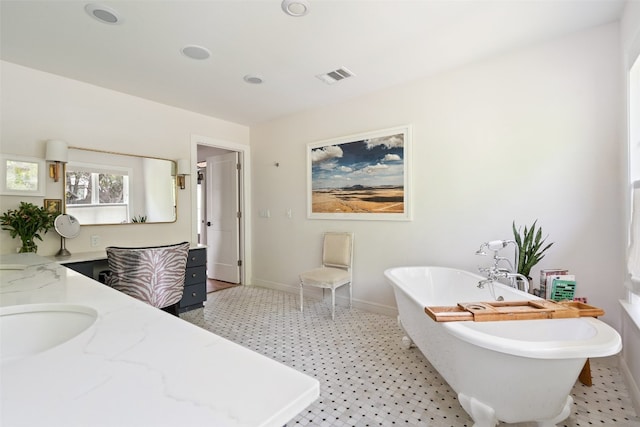 bathroom with vanity and a bathtub