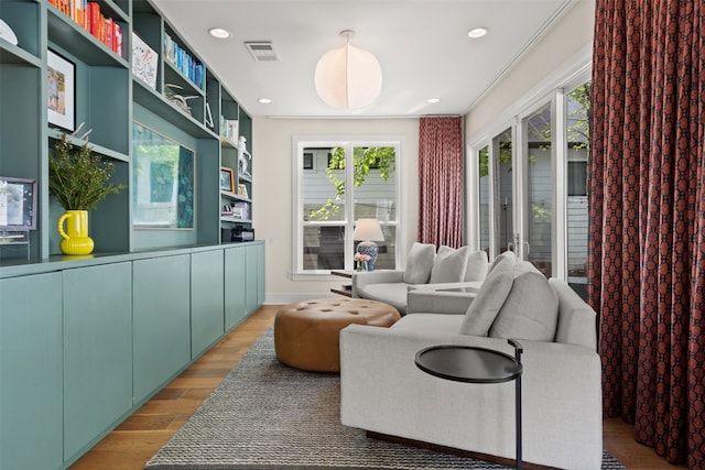 interior space with hardwood / wood-style flooring and a healthy amount of sunlight