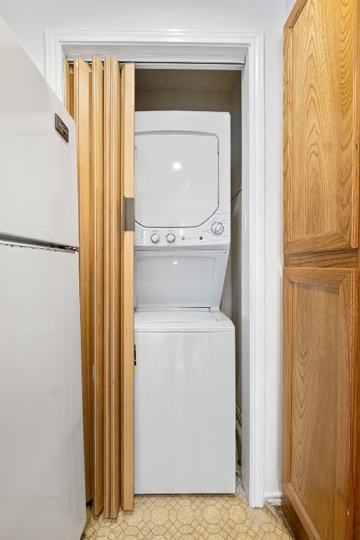 washroom with stacked washer and dryer