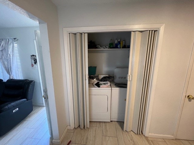 laundry area with washing machine and dryer