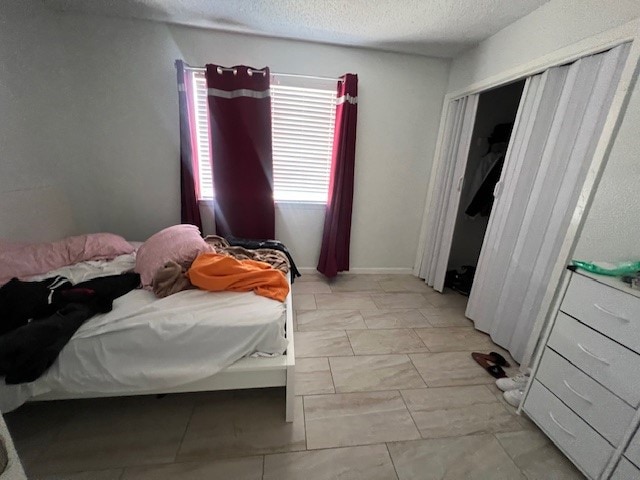 bedroom featuring a textured ceiling