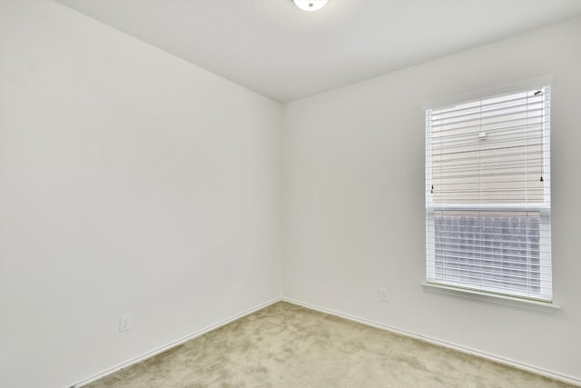 empty room with light colored carpet