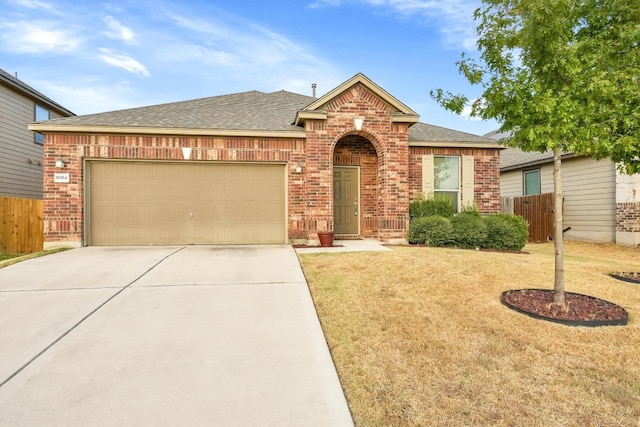 single story home with a front lawn and a garage