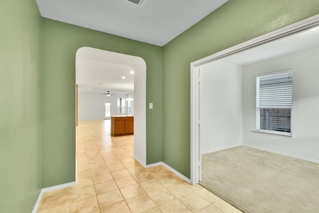 hallway with light carpet