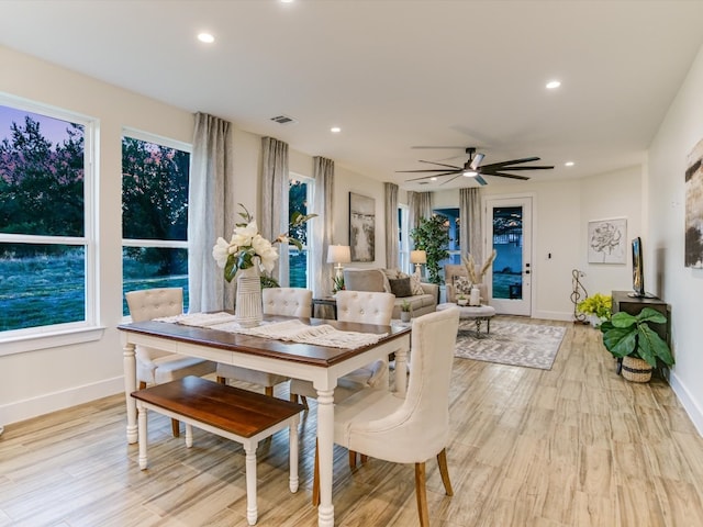 dining room featuring light wood-type flooring and ceiling fan