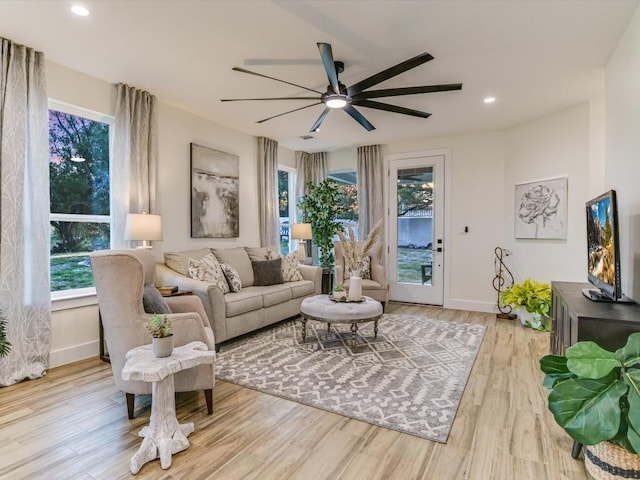 570 Quick Draw, Horseshoe Bay, TX 78657 - living room featuring a ceiling fan, healthy amount of natural light, wood finished floors, baseboards, and recessed lighting