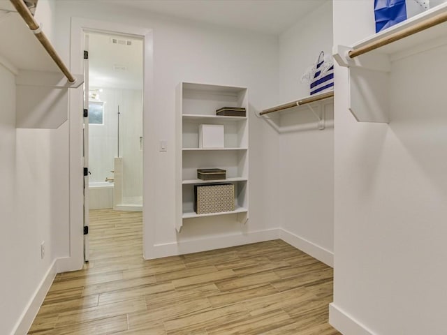 570 Quick Draw, Horseshoe Bay, TX 78657 - walk in closet with light wood-type flooring