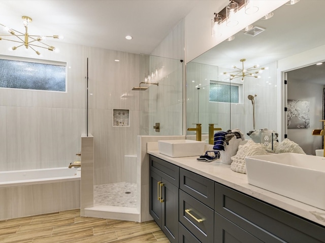 bathroom with vanity, shower with separate bathtub, and wood-type flooring