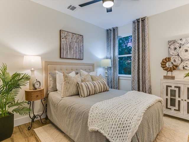 bedroom featuring light hardwood / wood-style floors and ceiling fan