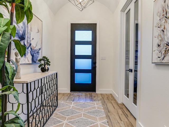 570 Quick Draw, Horseshoe Bay, TX 78657 - foyer with light wood-style flooring, vaulted ceiling, and baseboards