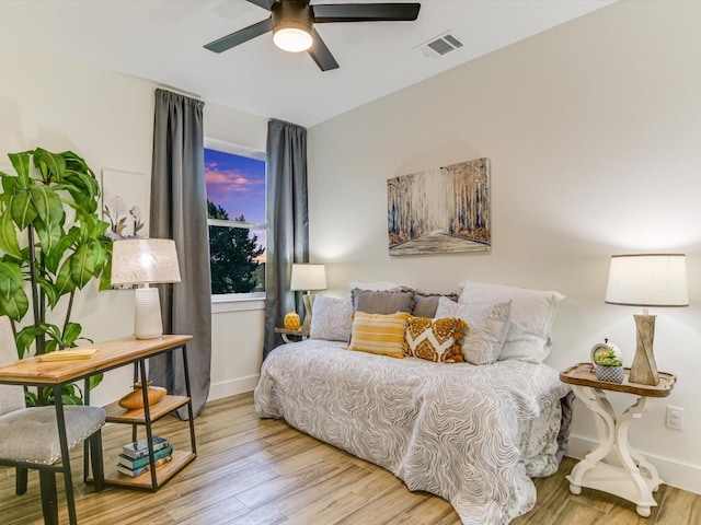 bedroom featuring light hardwood / wood-style floors and ceiling fan