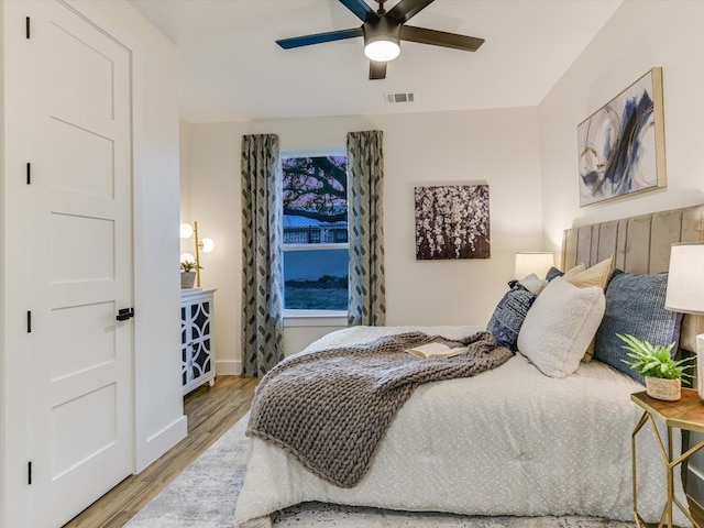 bedroom featuring wood-type flooring and ceiling fan