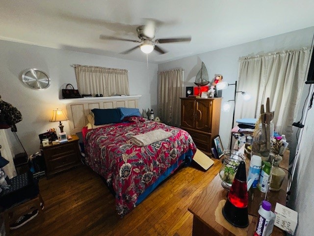 bedroom featuring dark wood-type flooring and ceiling fan