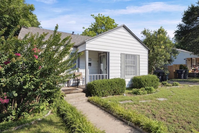 1514 S 13th St, Temple, TX 76504 - view of front of home featuring covered porch, a front yard, and a shingled roof